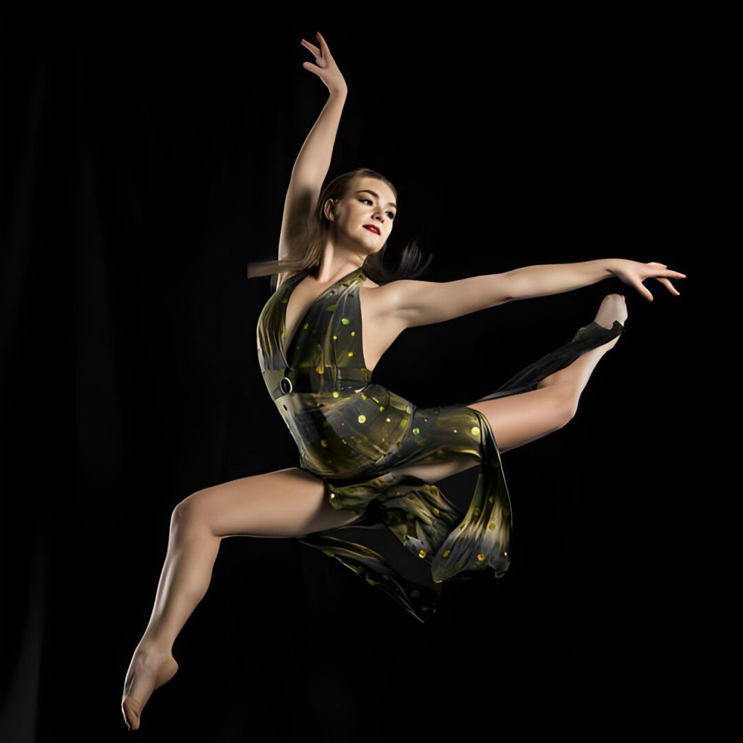 Dancer mid-leap in elegant pose.