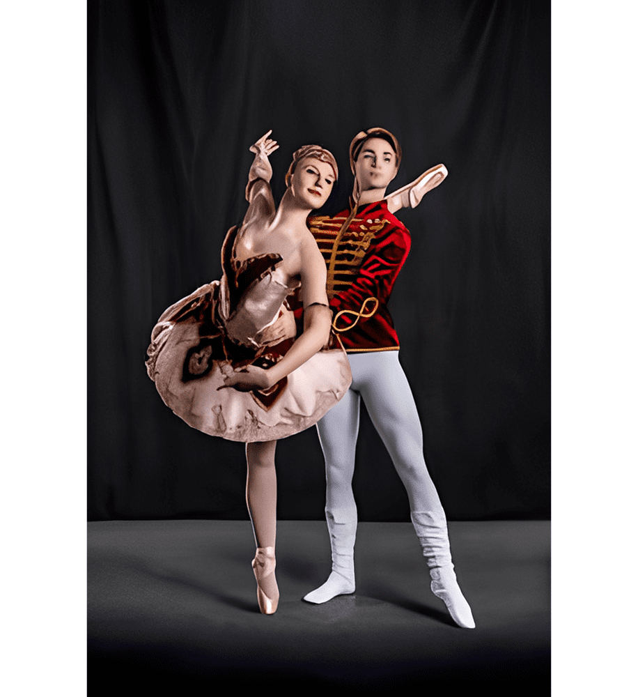 Ballet dancers performing on stage in costume.