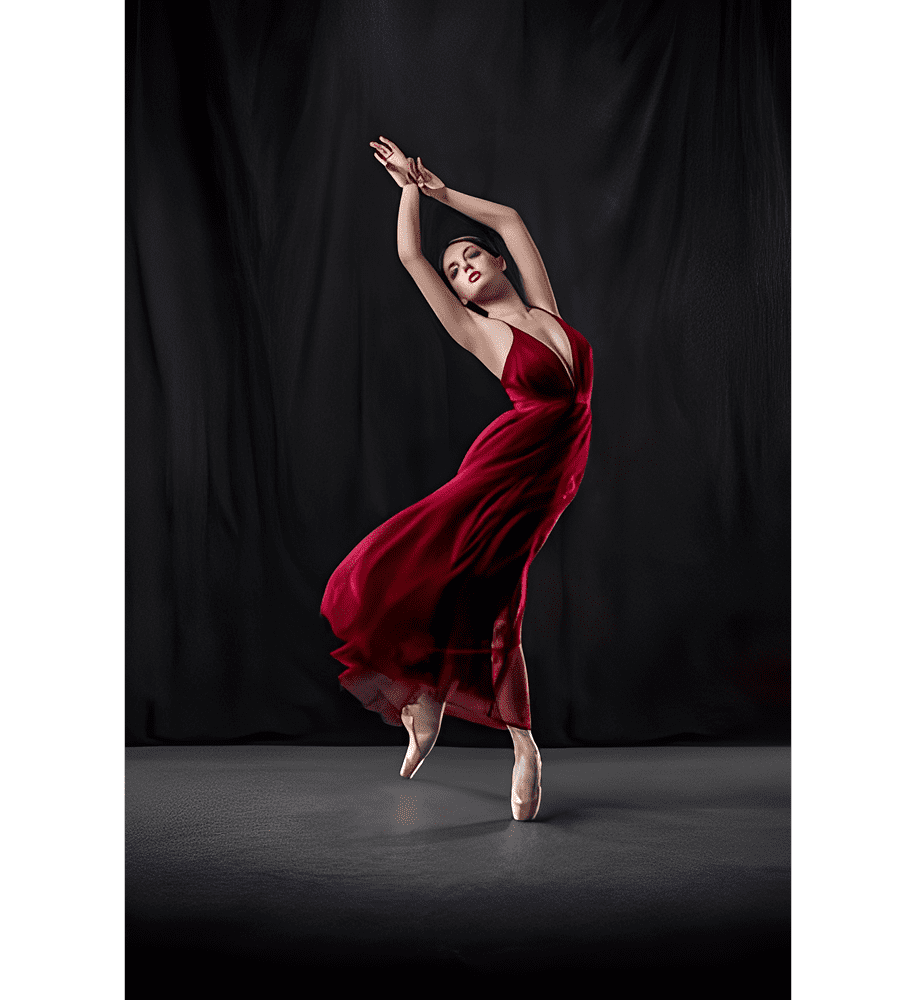 Ballet dancer in red dress, striking pose.
