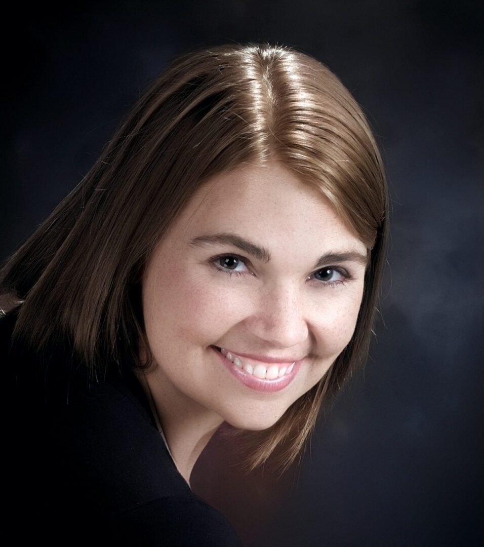 Portrait of smiling young woman with brown hair