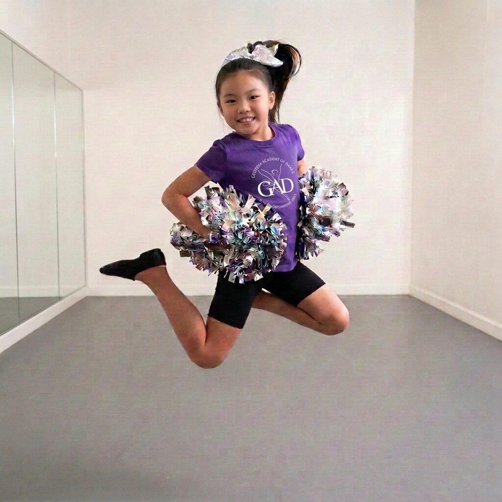 Young cheerleader jumping with pom-poms