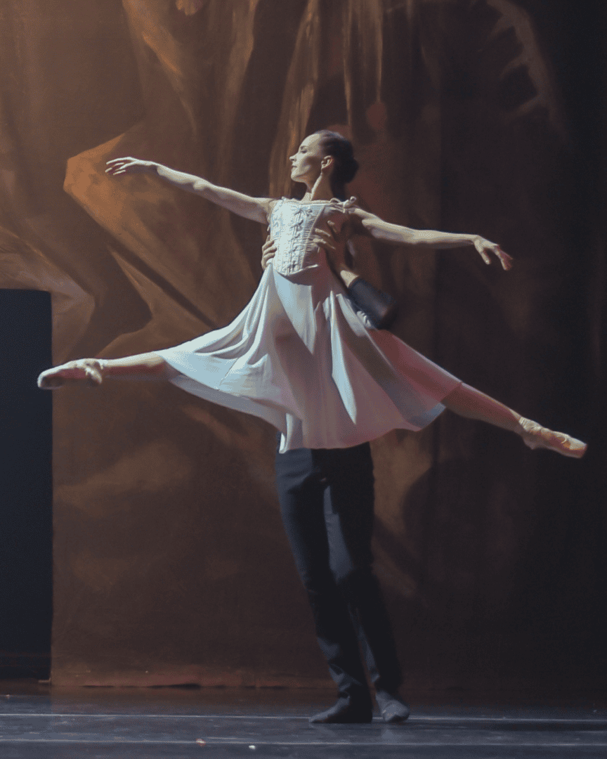 Ballerina lifted by male ballet partner